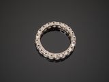 a close up of a diamond ring on a black surface