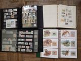 a lot of different stamps on a book on a table
