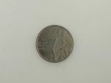 a close up of a coin on a white surface with a white background