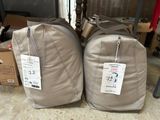 two bags of luggage sitting next to each other on the floor