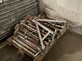 a pile of wood and a pile of metal on a pallet