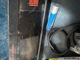 a black box with a yellow and red sign on it