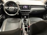 the interior of a car with a steering wheel, dashboard, and dashboard controls