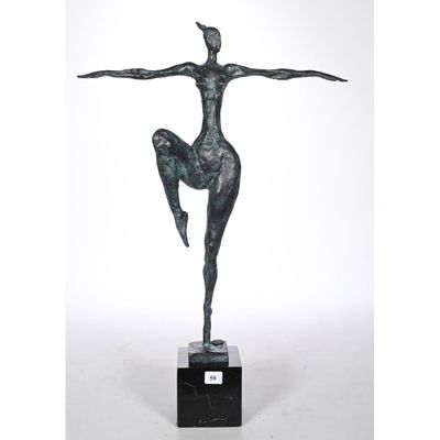 a bronze statue of a woman in a pose on a marble base