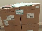 a stack of boxes sitting on a pallet in a room