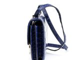 blue alligator skin cross body bag with shoulder strap on a white background