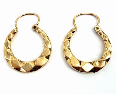 pair of gold tone hoop earrings with geometric design on white background