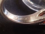 a close up of a ring on a black surface