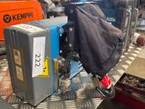 an image of a machine in a factory with a bag on the back of it