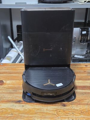 a black box sitting on top of a wooden table
