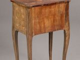 an old wooden table with a drawer on top of it