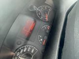 a car dashboard with a speedometer and gauges on it