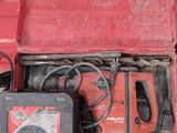a red tool box with tools in it sitting on a table