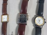 several different types of watches are lined up on a table