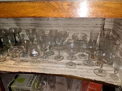 a shelf with a lot of glasses and glasses on it