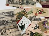 many old postcards on the table with pictures on them