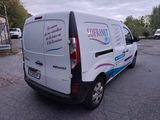 a white van that is parked on the side of the road