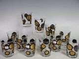 a lot of glasses that are sitting on a table