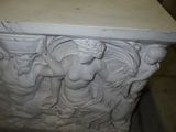a statue that is sitting on a table in a room