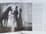 an open book with a picture of a man and a woman standing next to a horse