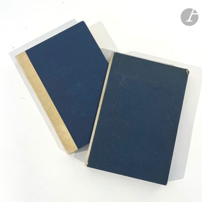 two books sitting next to each other on a white surface