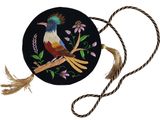 a picture of a round purse with a colorful bird on it