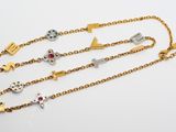 a close up of three different bracelets on a white surface