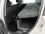 a car with the back door open and a tray in the trunk