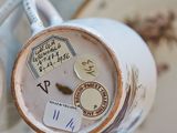 a close up of a cup and saucer on a table