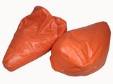 pair of orange leather bean bags on white background