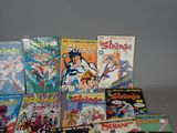a lot of comic books sitting on a table