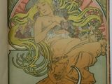 an old book with a picture of a woman sitting on top of it
