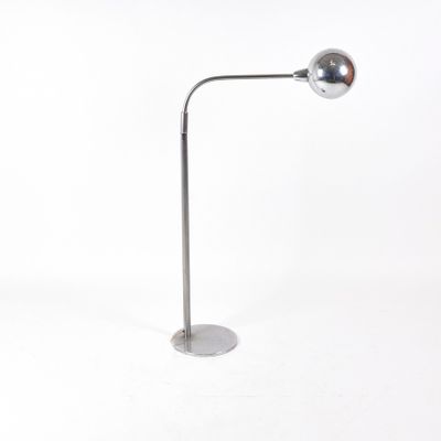 an image of a chrome plated floor lamp on a white background