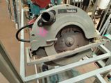 someone is using a circular saw to cut a piece of metal