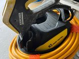a yellow hose with a black handle and a yellow hose attached to it