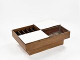 a wooden box with a white lid and drawers