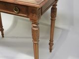 an old wooden table with a drawer on top of it