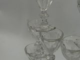 a lot of glasses that are sitting on a table