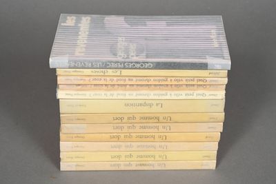 several books stacked on top of each other on a table