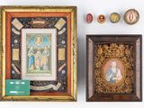two framed pictures of the virgin and child in a wooden frame