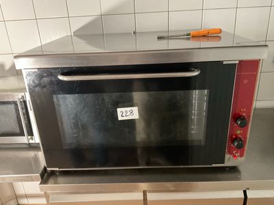 a microwave that is sitting on a counter in a kitchen