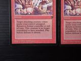 two cards that are sitting on a table