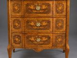 an antique chest of drawers with marble top