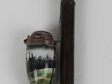 a picture of a picture of a baseball bat and a glass vase