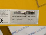a label on the back of a yellow box with a barcode on it