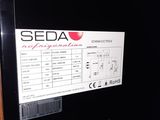 a sign on the door of a refrigerator that says seeda