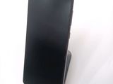 a cell phone that is sitting on top of a stand