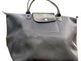 black longchamp bag on a white background