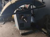 a machine that is sitting on the floor next to a bag