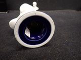 a blue and white vase sitting on a black surface